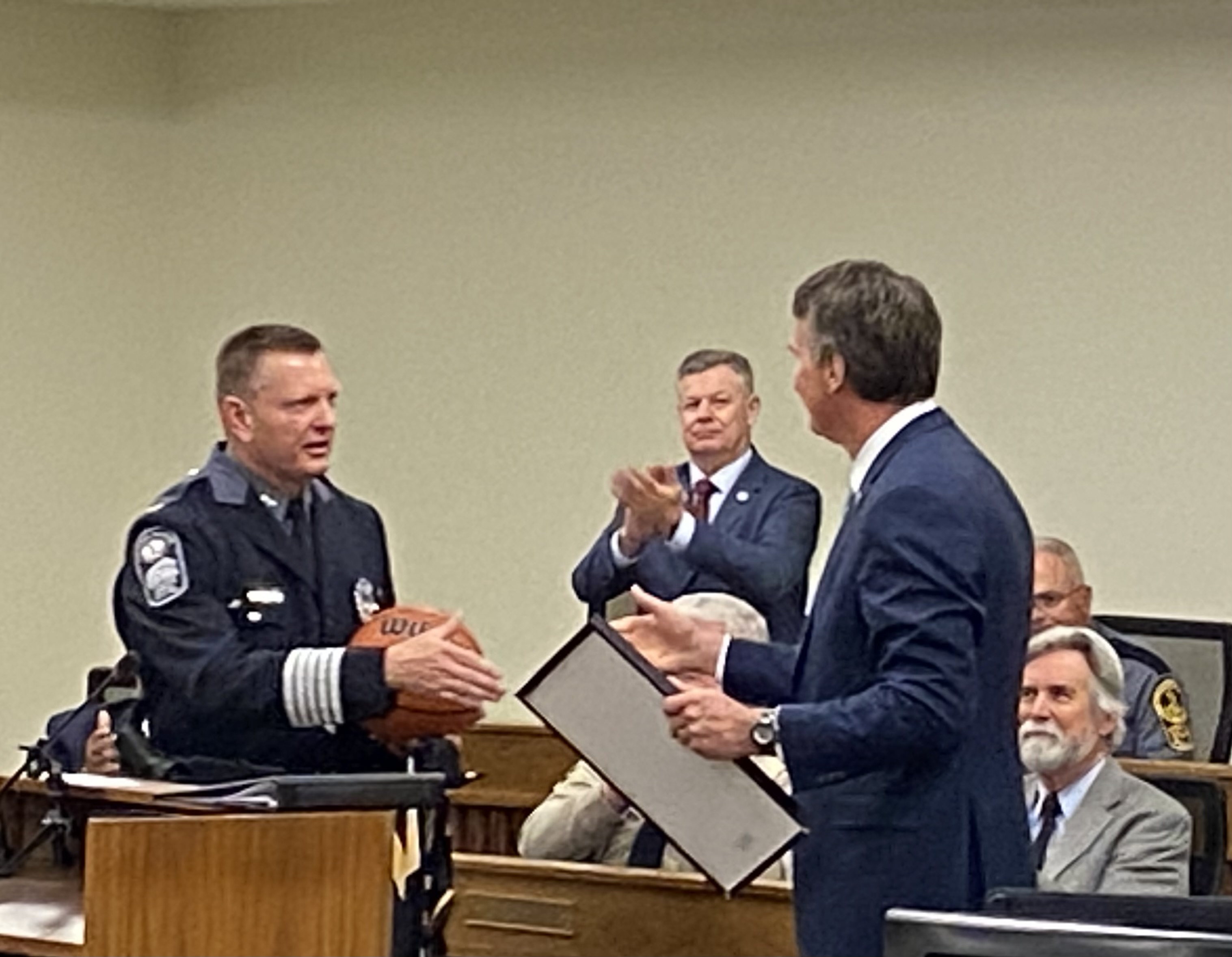 Gov. Youngkin reads and presents the declaration of  “Colonel Steve Pike Day” in the Commonwealth.