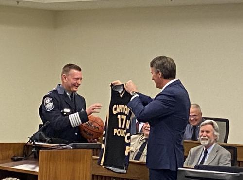 Gov. Youngkin presents Colonel Pike with a “Capital Police Basketball Jersey” for his retirement gift.