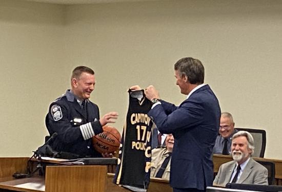 Gov. Youngkin presents Colonel Pike with a “Capital Police Basketball Jersey” for his retirement gift.