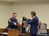 Gov. Youngkin presents Colonel Pike with a “Capital Police Basketball Jersey” for his retirement gift.